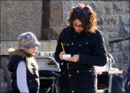 Actress Julie Graham signs an autograph for delighted young fan Sophie Adams