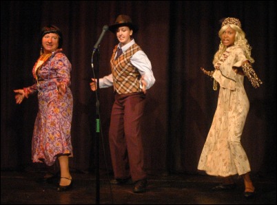 Miss Hannigan, Rooster and Lily in a song and dance routine