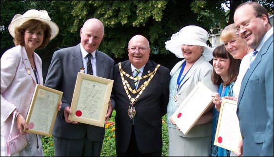 Civic award recepients Dave Perrett, Mrs Alex Davies, Mrs Di Monaghan and Christine Chapman (nee Deacon) who stood in for Steve Fear, alongside Mayor Eric Gill, Mayoress Gillian Hill and Kerry Rickards, the district council chief executive.
