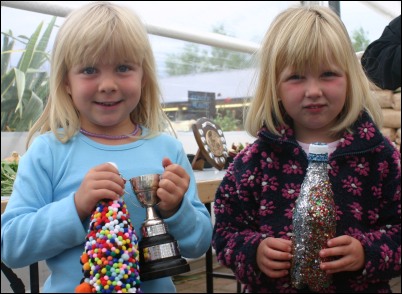 Talented Elizabeth Tolley, 5, and Catherine Tolley, 4, with their winning entries.