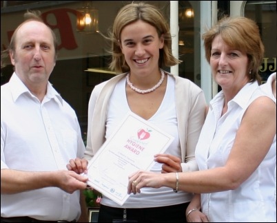 Jeff and Jackie Welsh receive their food hygiene award from Sarah Knife (centre)