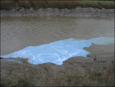 The blue effluent seen on the River Parrett