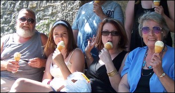 A family enjoy a cooling ice cream at Sunday's Picnic In The Park