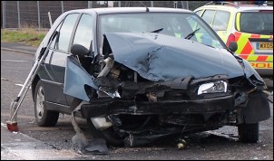 One of the dented vehicles involved in Saturday morning's collision