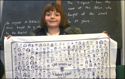 Rebecca Adderson, 9, with the commemorate tea towel