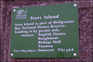 Signs on Burnahm seafront spell out that visiting the island is not permitted without a permit from English Nature