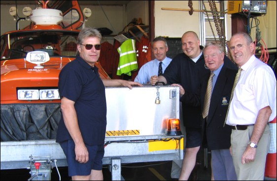 RNLI Operations Director Michael Vlasto and Divisional Inspector Simon Pryce with Alan Miller, Pete Emery and Neville Jones at the hovercraft station