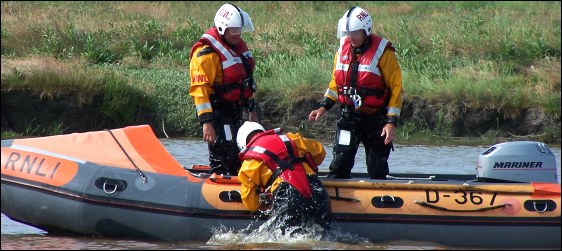 The lifeboat is right size up again and, after the engine's spark plugs are changed, it can go on its way again.