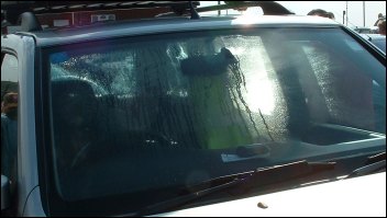 Condensation streams down the vehicle's windows