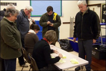 Onlookers watch the count taking place in Burnham Infants School on Thursday night