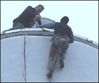 Workmen at the top of Burnham Lighthouse