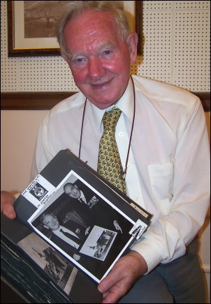 Neville Jones with a book of photos from his wartime experiences
