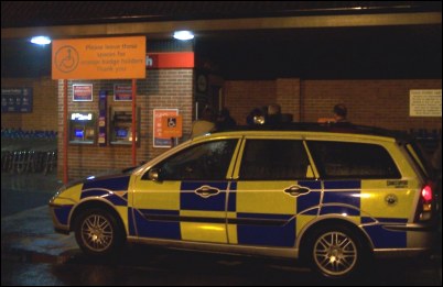 Police interviewing eyewitnesses next to the cash points at the back of the Burnham Tesco store on October 11th