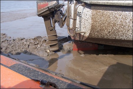 This photo taken onboard the hovercraft shows the yacht's motor stuck fast