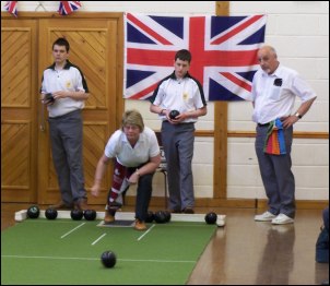 The short mat bowling competition in progress at Highbridge Community Hall.