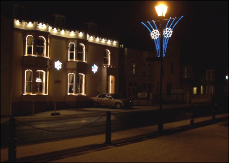 The festive lights on a seafront B&B add to the wintry scenes in Burnham