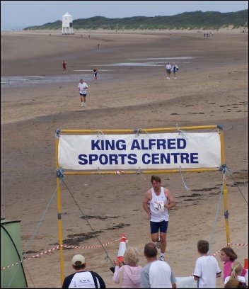 2005 Triathlon competitors pace along Burnham-On-Sea beach 