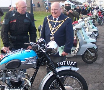 A 1961 Triumph Bonneville caught the attention of many enthusiasts, including Mayor Eric Gill who is shown with owner Tony Champeny