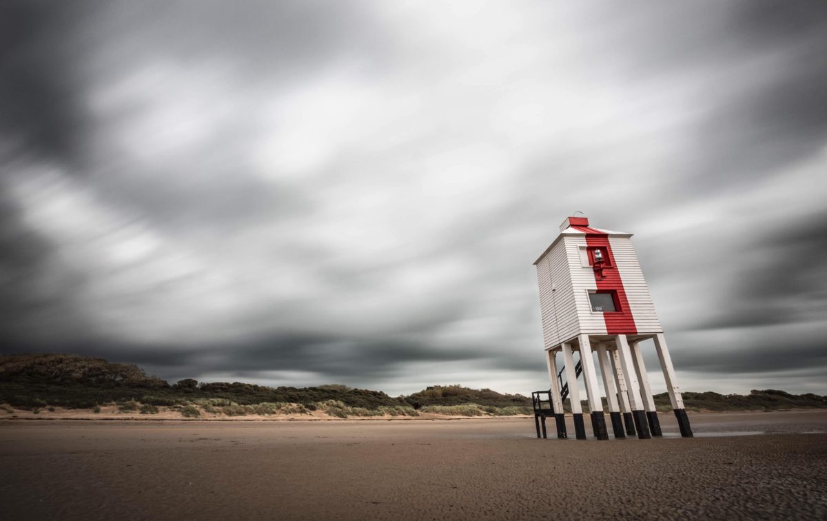 Burnham's lighthouse under stormy skies by Zenon Panteli