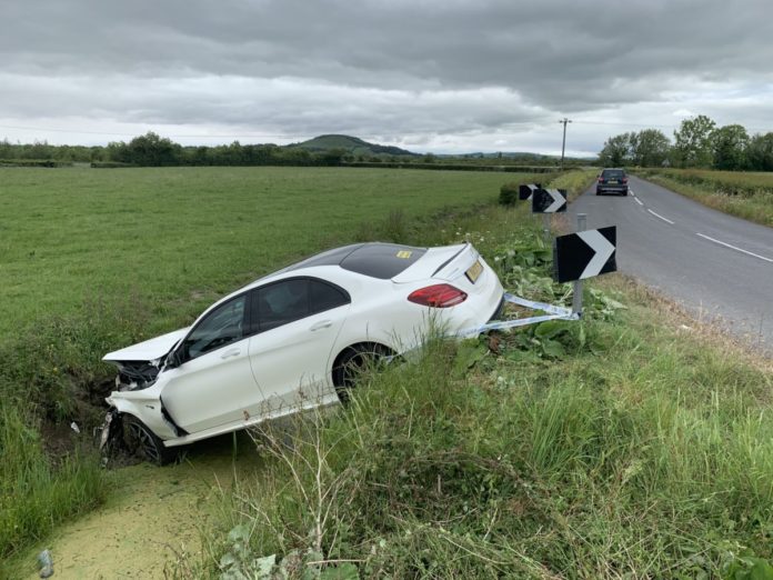 Car in ditch Burnham Moor Lane