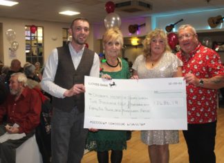 Burnham-On-Sea Ritz Social Club with bumper-sized cheque for Children's Hospice South West