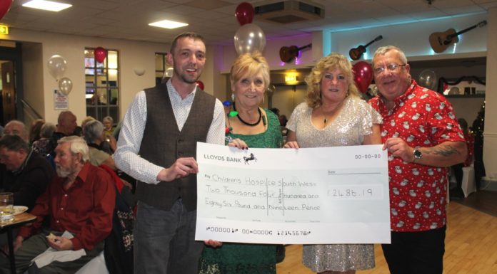 Burnham-On-Sea Ritz Social Club with bumper-sized cheque for Children's Hospice South West