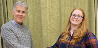 Burnham and Highbridge Town Band Principal Cornet Bill Sutton greets new conductor Felicity Day