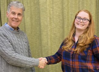Burnham and Highbridge Town Band Principal Cornet Bill Sutton greets new conductor Felicity Day