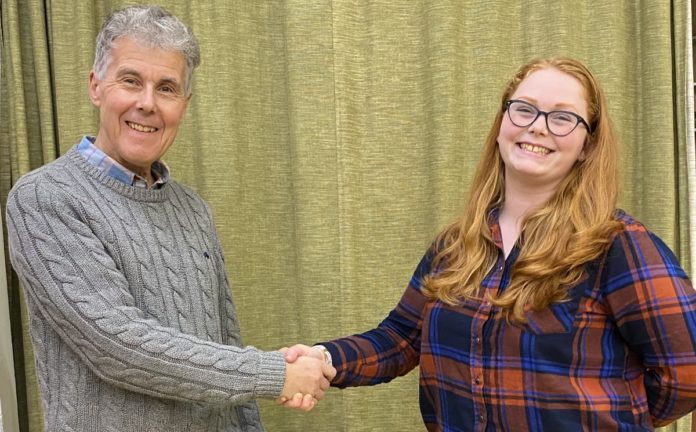 Burnham and Highbridge Town Band Principal Cornet Bill Sutton greets new conductor Felicity Day