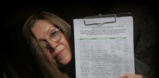Joy Russell with the petition over Highbridge Lakeside homes plan