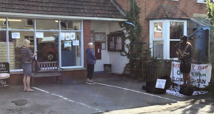 Burnham busker Taylor Topham entertains customers at Brent Knoll shop