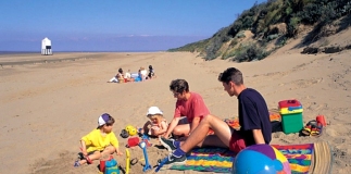 Family on beach at Burnham-On-Sea