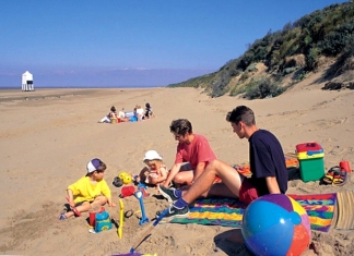 Family on beach at Burnham-On-Sea