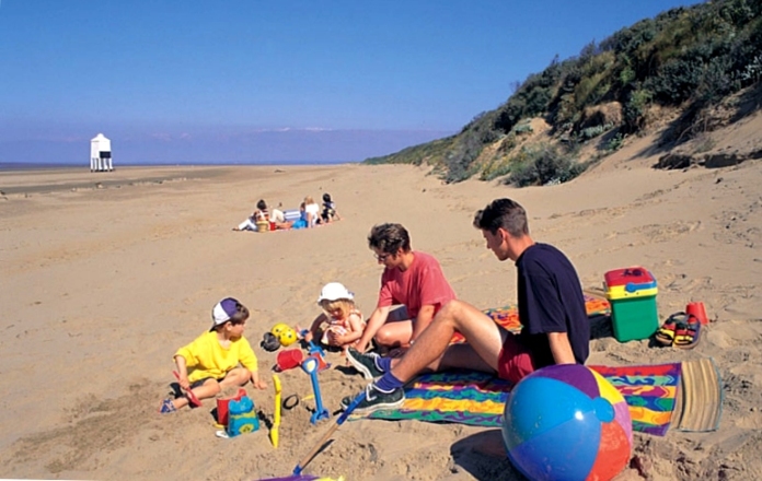 Family on beach at Burnham-On-Sea