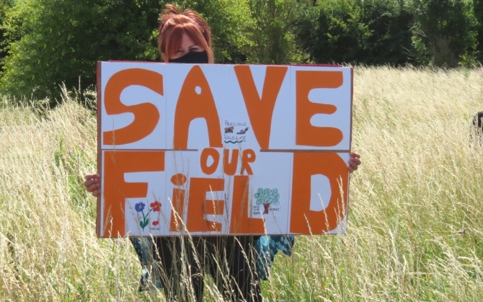 Dozens of residents protest against plans to sell Highbridge field