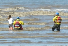 Burnham-On-Sea Coastguards rescue girl stuck in mud in sea water on Brean beach