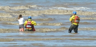 Burnham-On-Sea Coastguards rescue girl stuck in mud in sea water on Brean beach