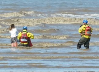 Burnham-On-Sea Coastguards rescue girl stuck in mud in sea water on Brean beach