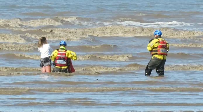 Burnham-On-Sea Coastguards rescue girl stuck in mud in sea water on Brean beach