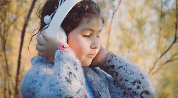 Child listening to podcast