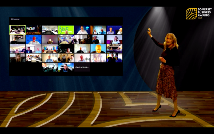 Claire Carter with video wall of finalists Somerset Business Awards