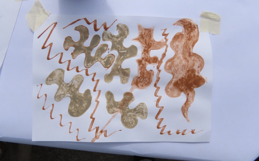 Beach mud painting session on Brean beach near Burnham-On-Sea