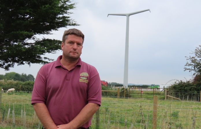 Rob Davey with a Hinkley Point T-Pylon in the background at East Huntspill