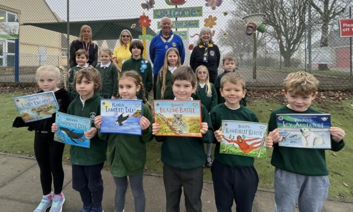 Children receive new books to help fight climate change