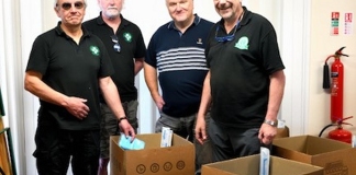 Dr Chris Howes (left) and other FMS volunteers packing the trauma kits for Ukraine at FMS HQ in Evercreech