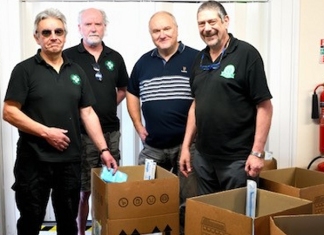 Dr Chris Howes (left) and other FMS volunteers packing the trauma kits for Ukraine at FMS HQ in Evercreech