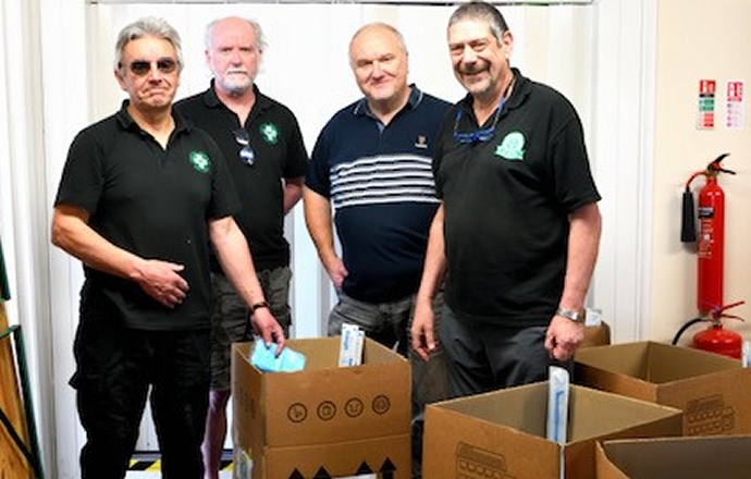 Dr Chris Howes (left) and other FMS volunteers packing the trauma kits for Ukraine at FMS HQ in Evercreech