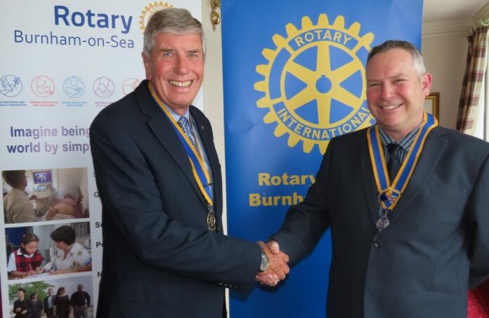 Burnham-On-Sea Rotary Club President David Stickels with outgoing President Chris Ashton