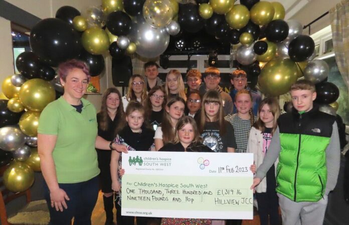 Burnham's Hillview Carnival Club presents a bumper cheque to Childrens Hospice South West