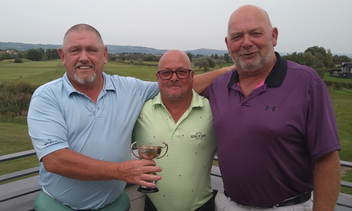 Brean Golf Club's Seniors Open Pairs winners Leighton Jenkins (left) and Chris Fairchild (right) flanking Seniors Captain Ian Rogers